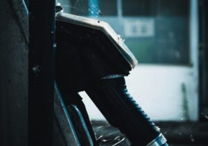 side view of a fuel pump in dark tones