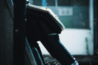 side view of a fuel pump in dark tones