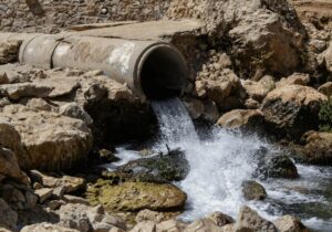 Groundwater coming out of large cement pipe