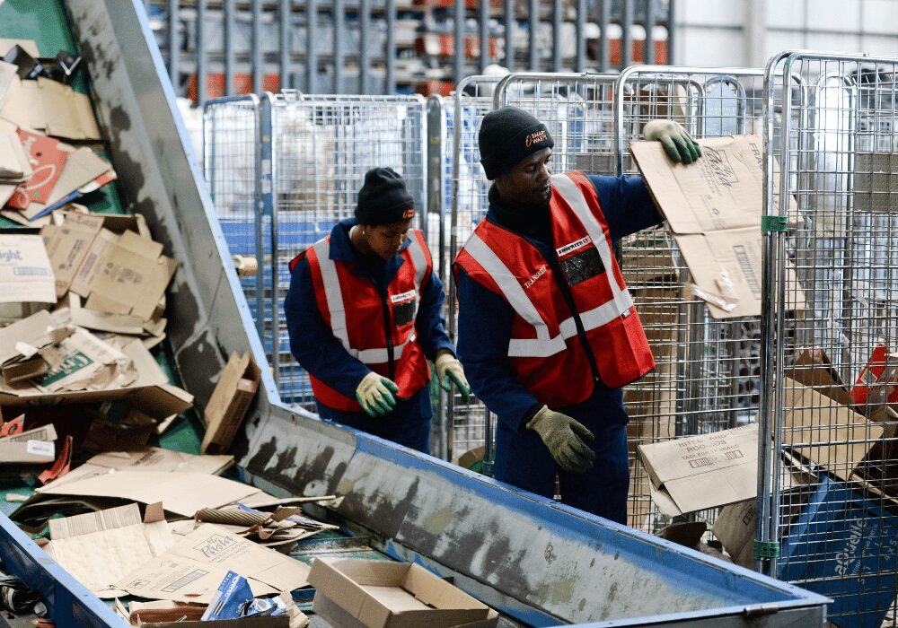Shoprite workers sorting cardboard recycling