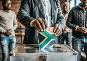 South African flag into voting ballot box