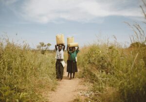 borehole water collection by children in Africa