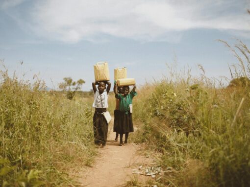 borehole water collection by children in Africa
