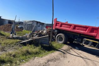 illegal waste dump off red garbage truck