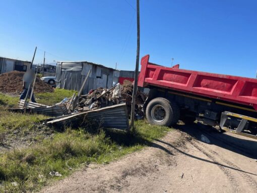 illegal waste dump off red garbage truck