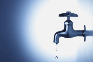leaking water tap on a dark blue background