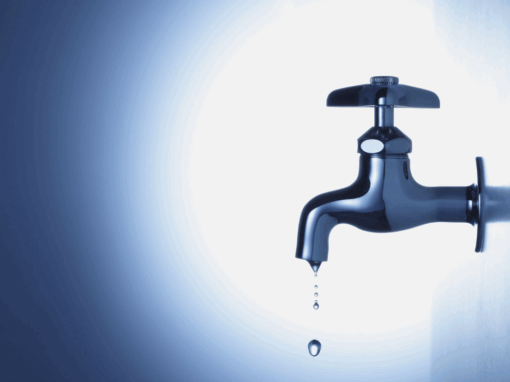 leaking water tap on a dark blue background