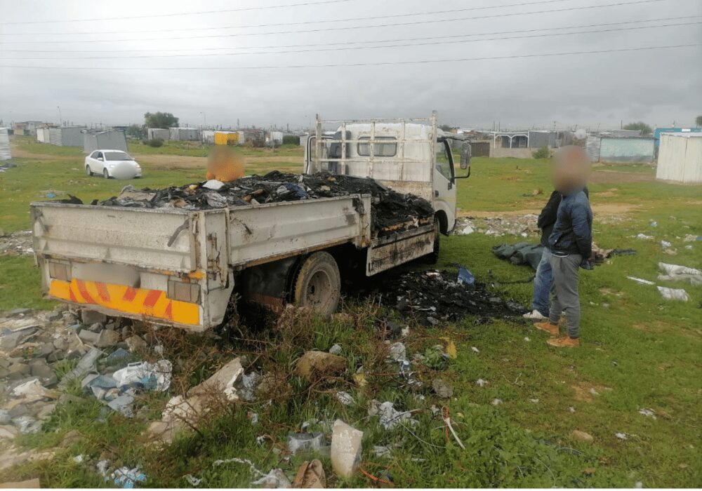 refuse truck dropping off waste