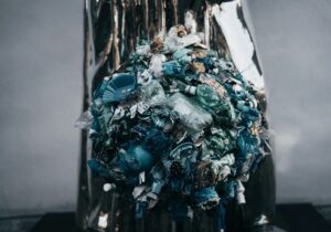rubbish bin piled with plastic