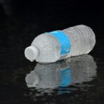 water bottle lying on ground during rain