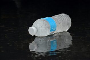 water bottle lying on ground during rain