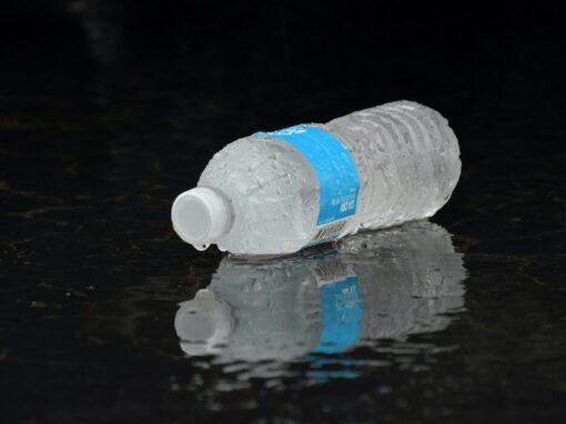 water bottle lying on ground during rain