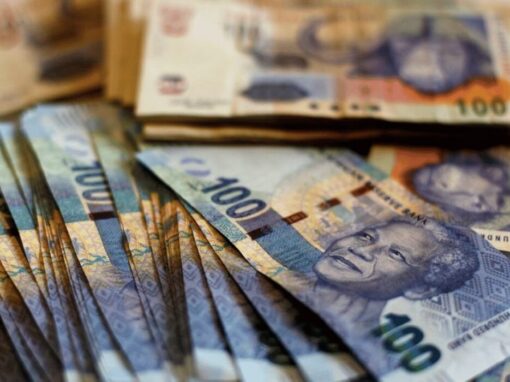 South African hundred rands notes stacked together