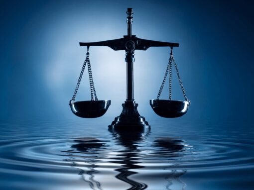 balancing scale ontop of dark blue water