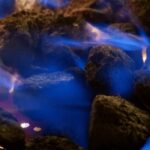 coal on fire with blue flames