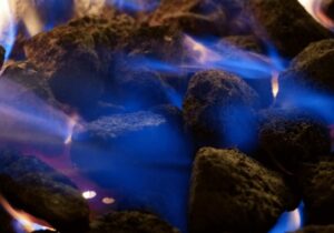 coal on fire with blue flames