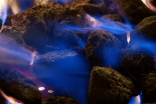 coal on fire with blue flames