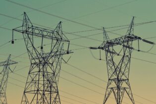 electricity powerlines against a blue sky