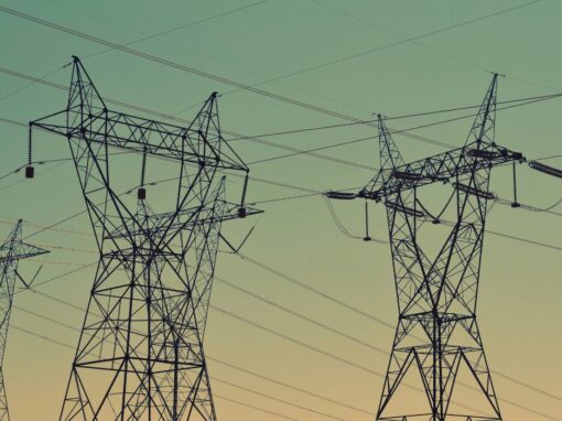 electricity powerlines against a blue sky