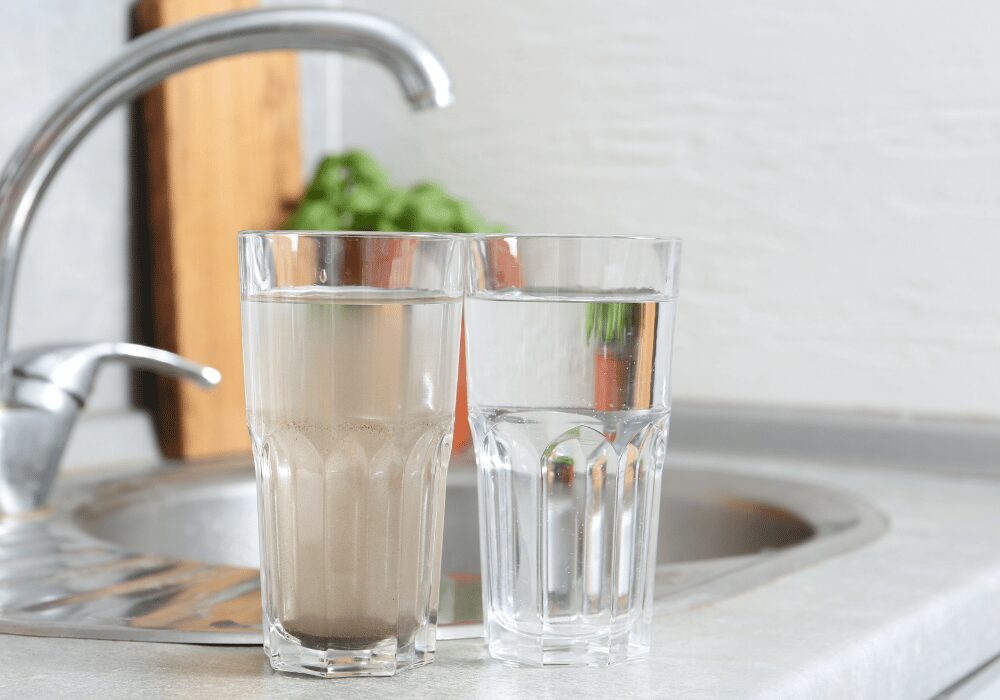example of clean and dirty water in glasses beside kitchen tap