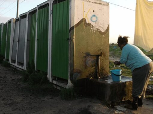 A communal tap in an informal settlement in Cape Town