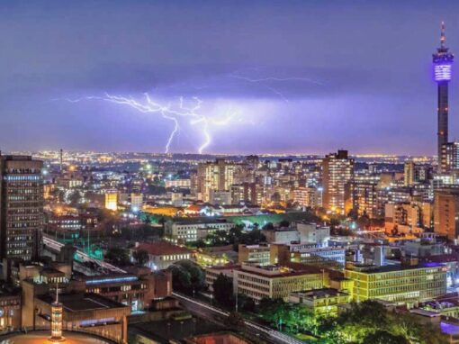 City of Johannesburg with a lightning strike in the background during storm