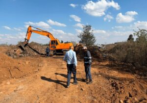 Crane clearing a blockage from a field for the Rondebult Bird Sanctuary