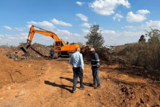 Crane clearing a blockage from a field for the Rondebult Bird Sanctuary