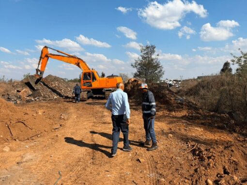 Crane clearing a blockage from a field for the Rondebult Bird Sanctuary