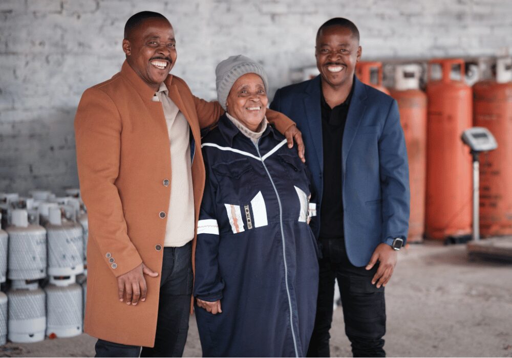 PB Gaz founders with employee with gas cannisters in the background