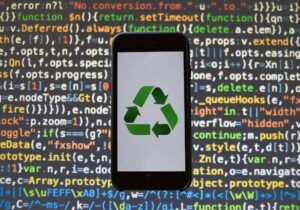 Recycling symbol on a phone app against coding language
