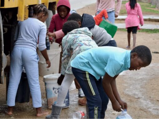 Residents fetch water from a truck in KwaNobuhle, in the Eastern Cape