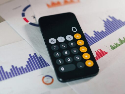 cellphone calculator on top of bar graph calculations