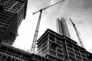 construction site in greyscale from the bottom view up