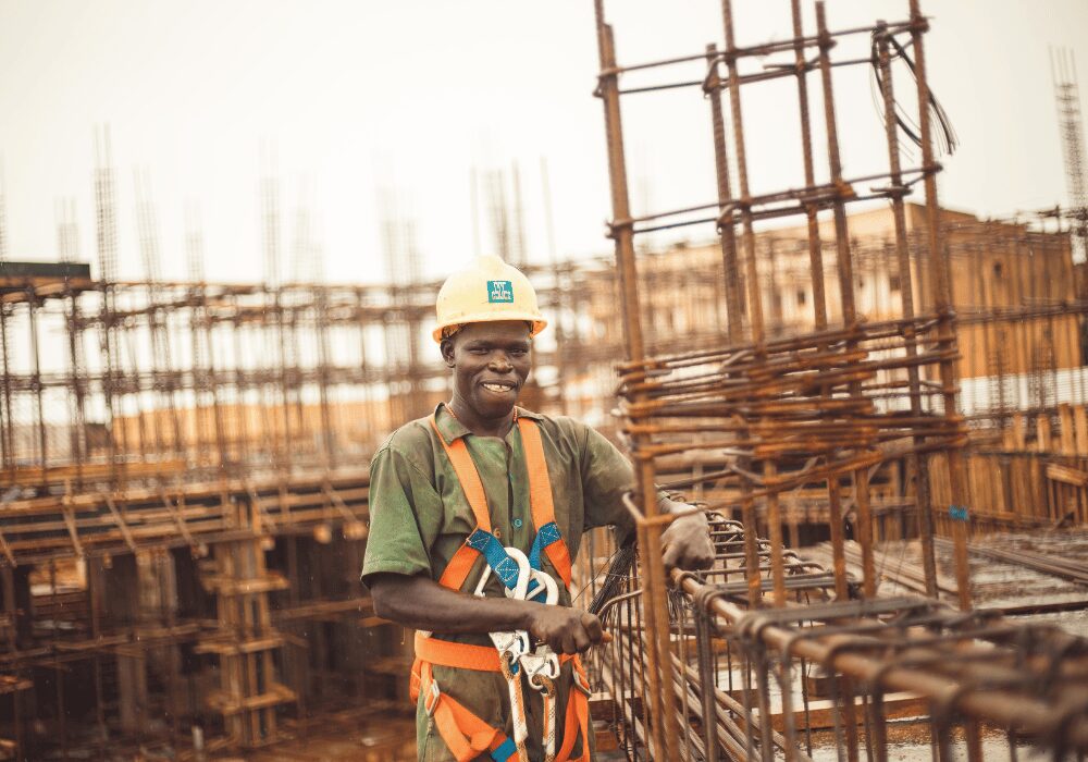 construction worker on site amongst steel casings
