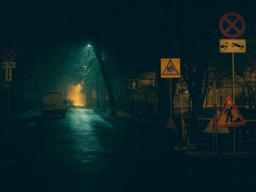 dark street with infrastructure and building signs