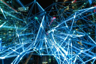 digital data between buildings in bright blue colours