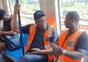 two men sitting on the Durban’s passenger rail service