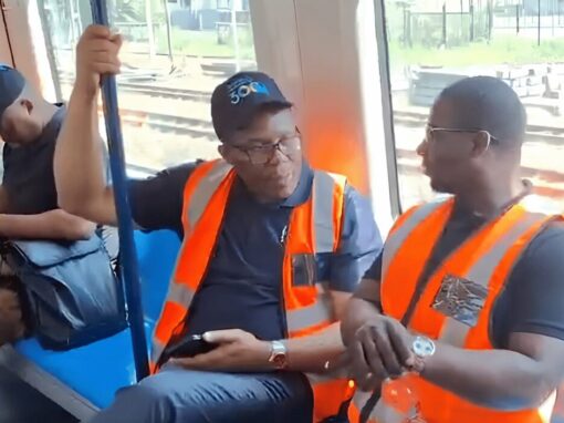 two men sitting on the Durban’s passenger rail service