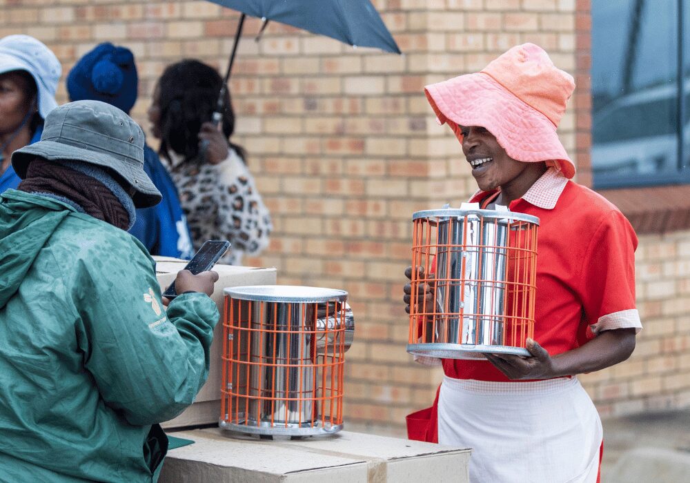 Cooking with an energy-efficient cookstove that uses less fuel and produces fewer emissions.