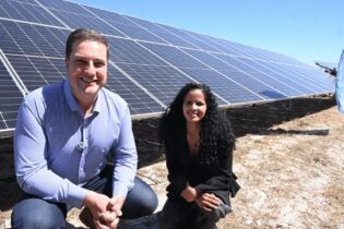 Mayor Hill-Lewis and Alderman Limberg infront of a solar panel