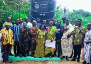WellsForAll group photo infront of water tower