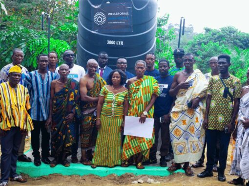 WellsForAll group photo infront of water tower