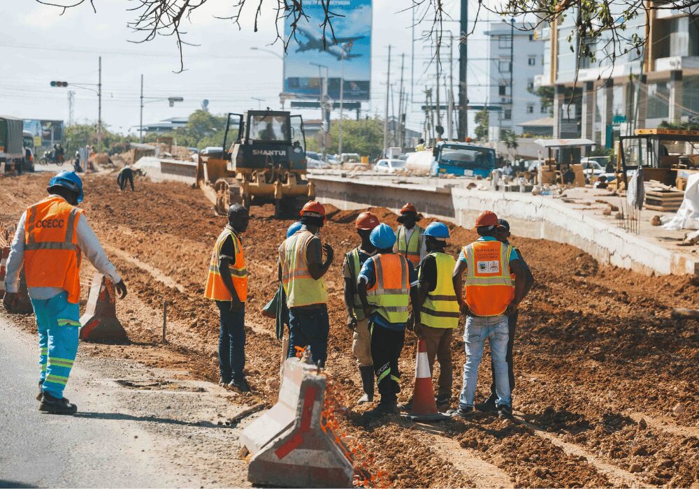 construction workers digging up road