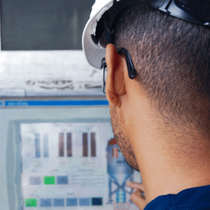 engineer from behind looking at a calculation screen