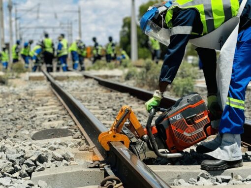 rail construction worker working in a rail with a K1270 rail machine