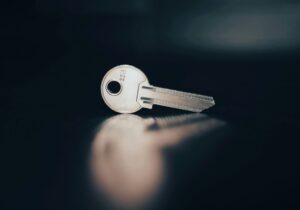 rental housing key isolated on a black background