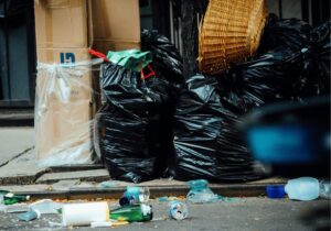 waste bags left on the side of the street