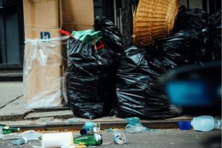 waste bags left on the side of the street